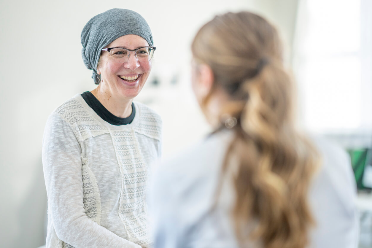 Patient with brain injury smiling with carer