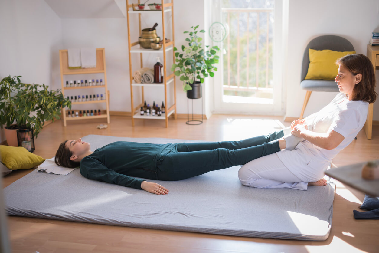 Woman receiving physical therapy at home